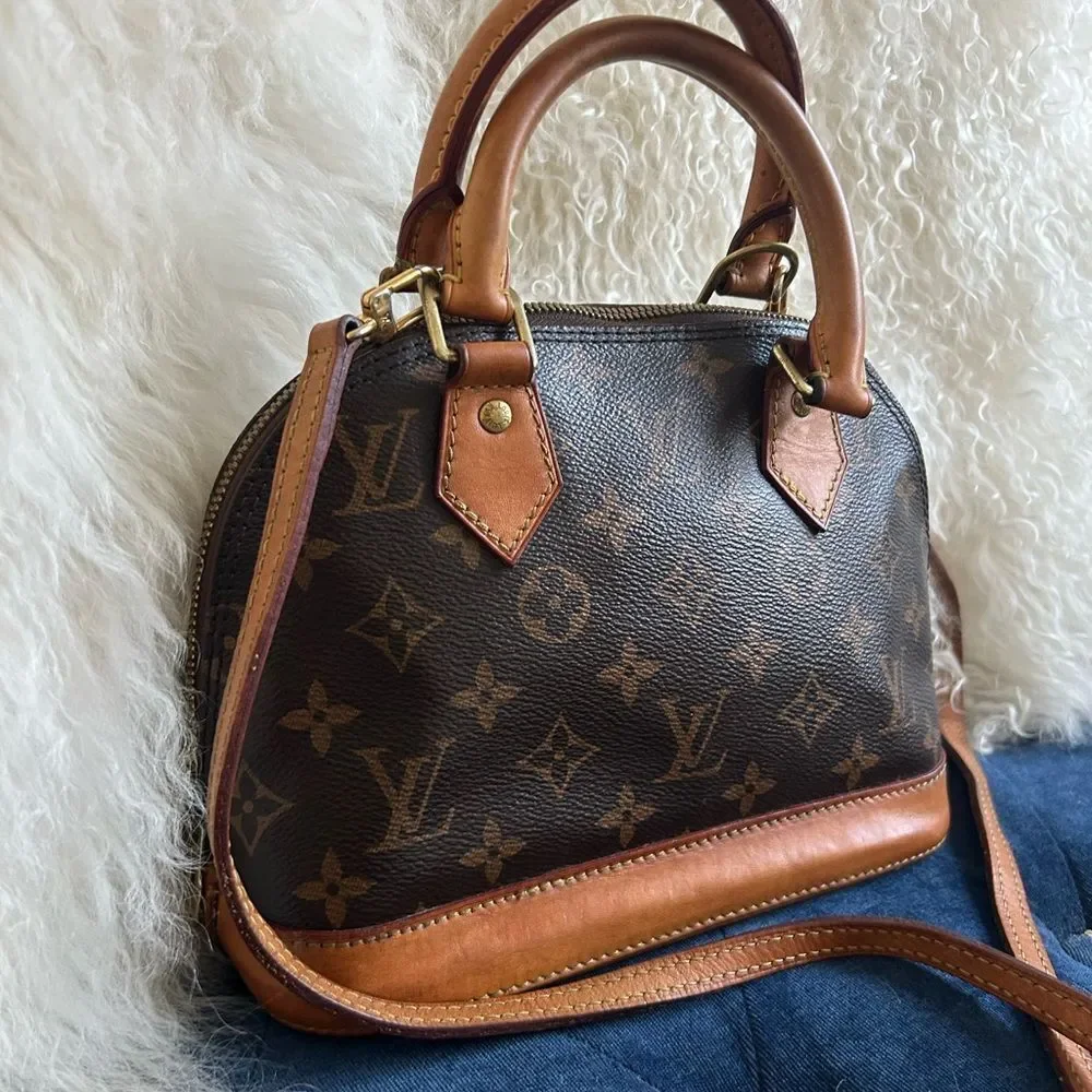 Louis Vuitton Alma bb leather handbag